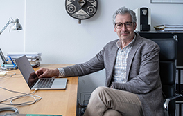 Professor sitting at his desk