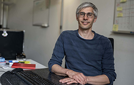 Researcher sitting at his desk