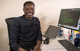 PhD Researcher sitting at his desk